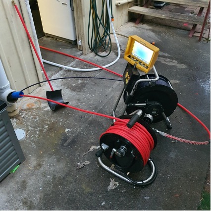 A drain camera and jetter combination