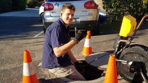 Dan working in sewer pit