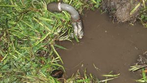 The pool of water from a leaking GAL pipe.